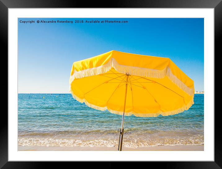 Giant yellow beach umbrella next to the ocean agai Framed Mounted Print by Alexandre Rotenberg