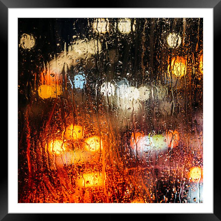 Raindrops on street window Framed Mounted Print by Alexandre Rotenberg