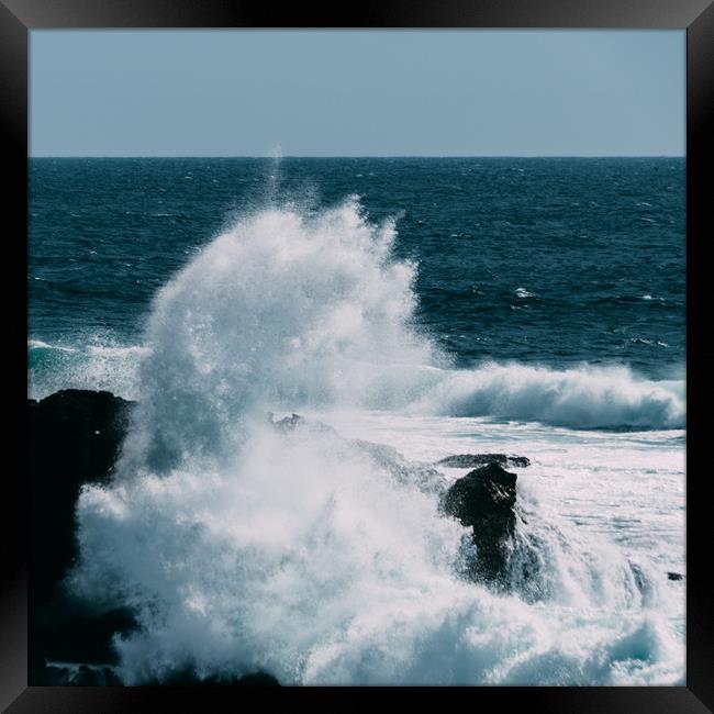 Wave crashes onto rocks on storm day Framed Print by Alexandre Rotenberg