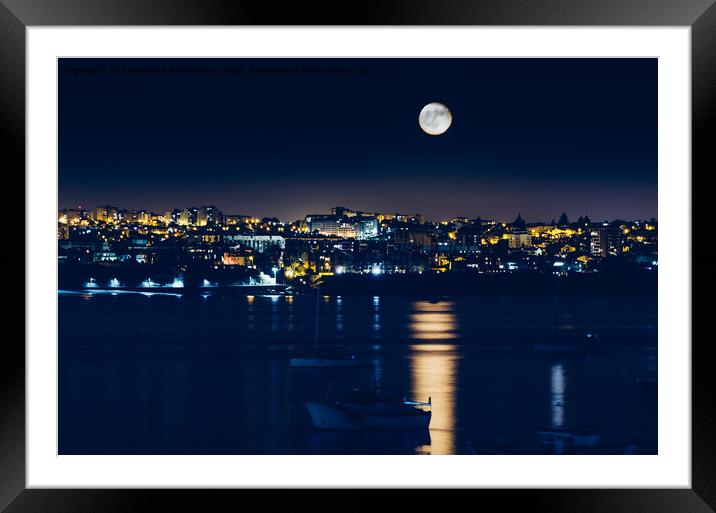 Night view of Cascais, Portugal with full moon reflecting on water and fishing boats Framed Mounted Print by Alexandre Rotenberg