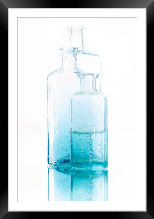Blue Medicine Bottles Framed Mounted Print by Kelly Bailey