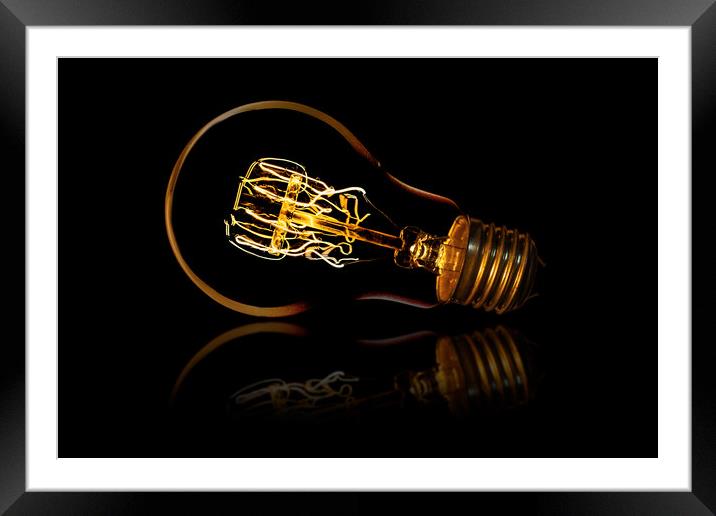Screw in bulb and reflection Framed Mounted Print by Donnie Canning