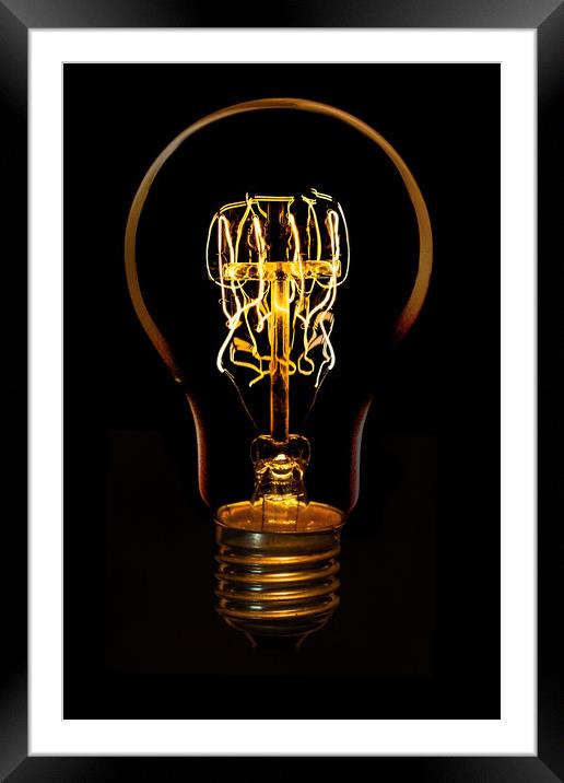 Edison bulb alight Framed Mounted Print by Donnie Canning