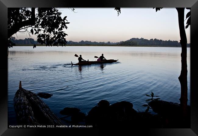 Paddling on lake Tana Framed Print by Franck Metois