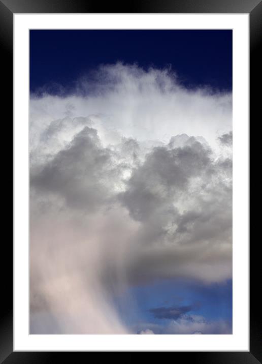 Snow falling from dramatic storm clouds Framed Mounted Print by Linda More