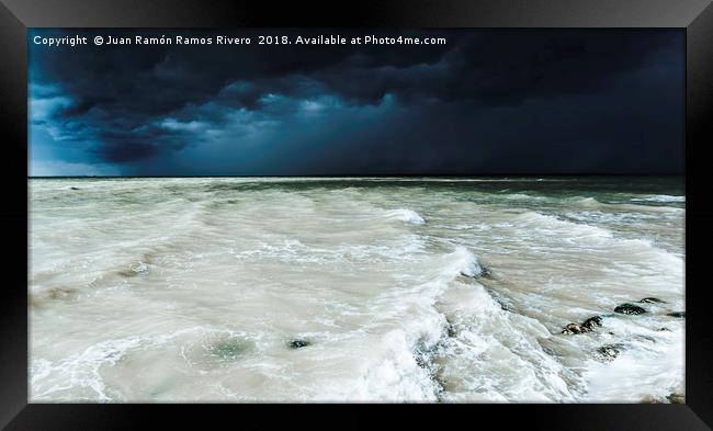 Storm sky on the beach of Sanlucar de Barrameda at Framed Print by Juan Ramón Ramos Rivero