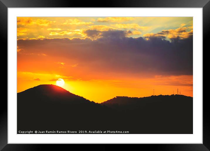 Panorama of sunset orange sky with sun Framed Mounted Print by Juan Ramón Ramos Rivero