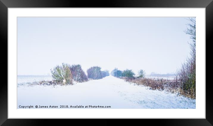 Looking down a Railway line in a Blizzard Framed Mounted Print by James Aston