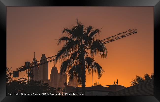 Sunset over the Internet City Dubai Framed Print by James Aston
