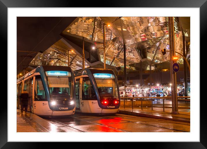 Barcelona trams at night Framed Mounted Print by Andrew Michael