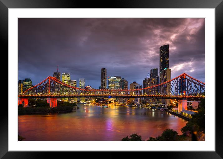 Story Bridge lit up after dark with Brisbane city  Framed Mounted Print by Andrew Michael