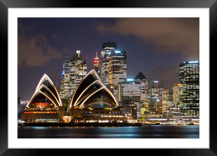Sydney Opera House and skyline after dark.  Framed Mounted Print by Andrew Michael