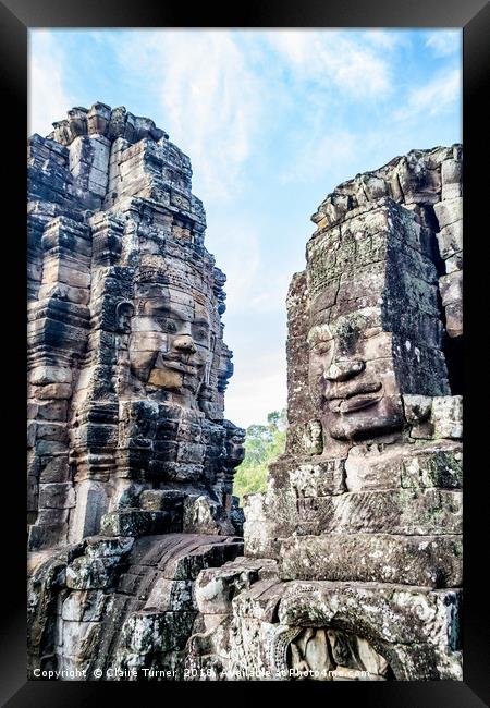 Bayon temple smiling faces Framed Print by Claire Turner