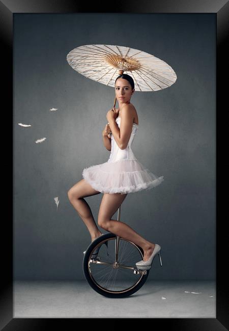 Lady on a unicycle Framed Print by Johan Swanepoel