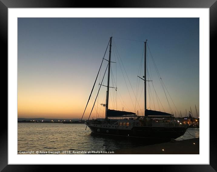 Yacht at sunset, Ortigia, Sicily Framed Mounted Print by Ailsa Darragh