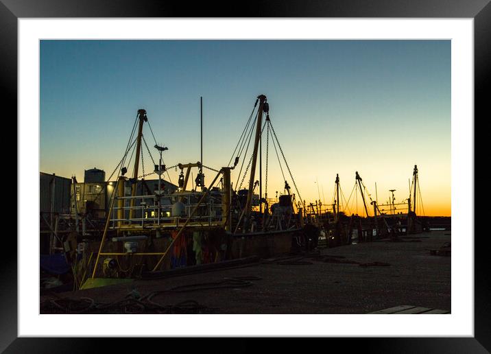 Silhouette of fishing boats Framed Mounted Print by Clive Wells