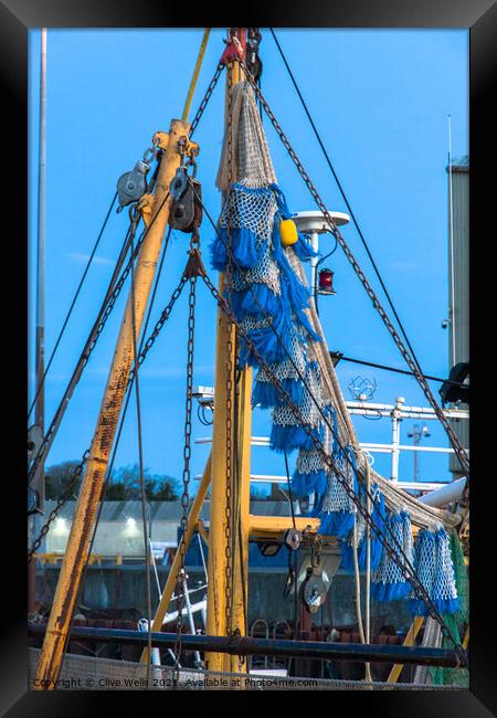 Fishing nets Framed Print by Clive Wells
