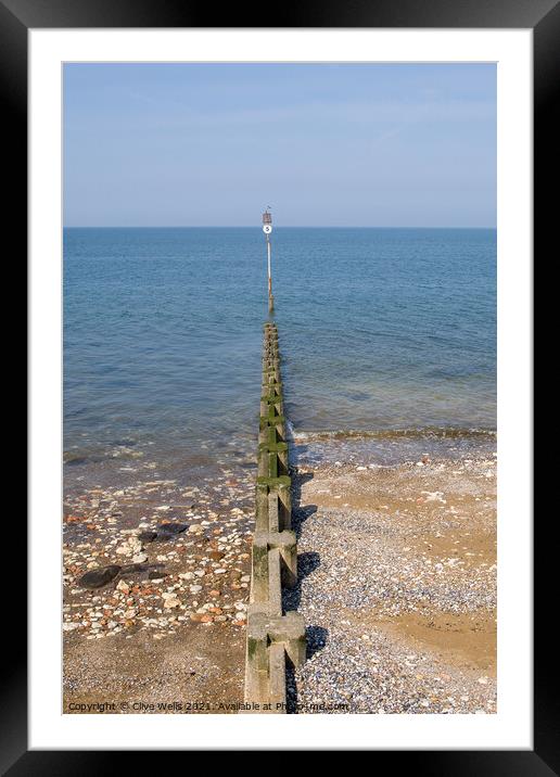 Groyne sea defence going out to sea Framed Mounted Print by Clive Wells