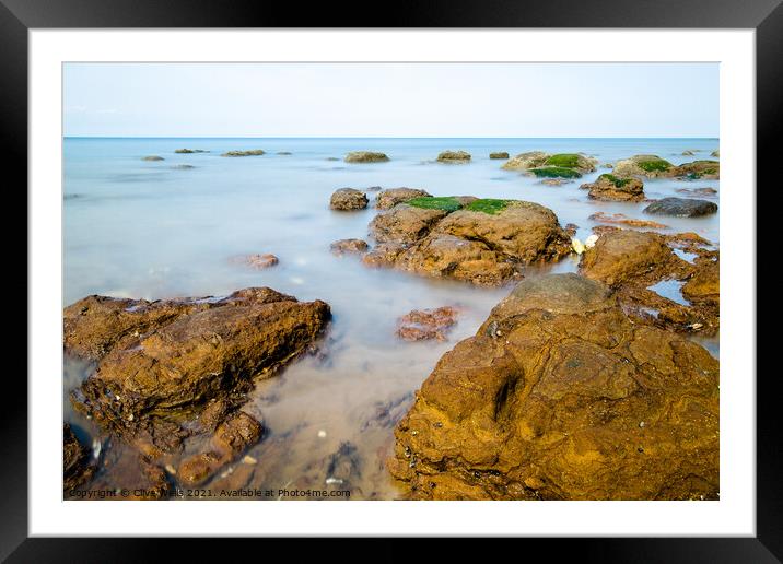 Rocks in the sea Framed Mounted Print by Clive Wells