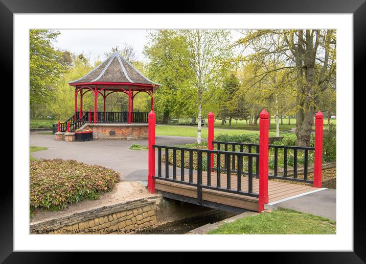 Footbridge and band stand Framed Mounted Print by Clive Wells