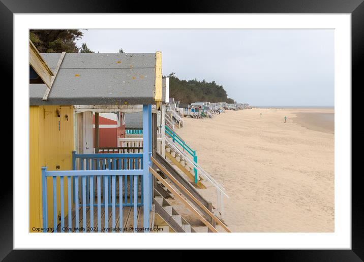 Line of beach huts Framed Mounted Print by Clive Wells