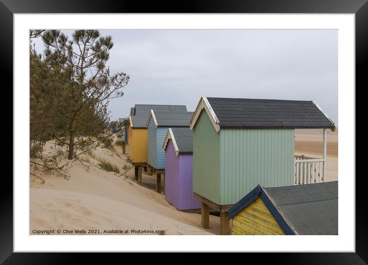 Beach huts in the dunes Framed Mounted Print by Clive Wells