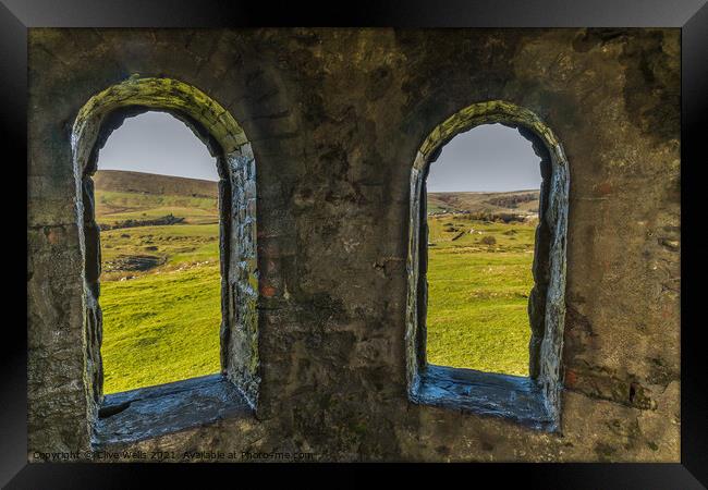 Looking through the arches Framed Print by Clive Wells