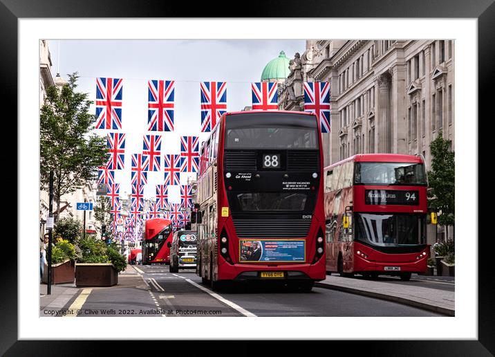Regent Street with bunting and buses Framed Mounted Print by Clive Wells