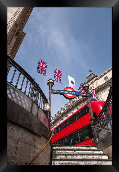 Bunting above the tube station with London bus. Framed Print by Clive Wells