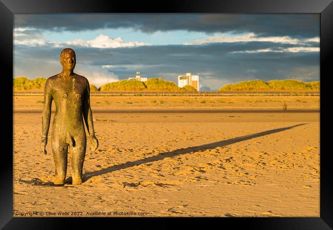 Golden hour and the Iron Man Framed Print by Clive Wells
