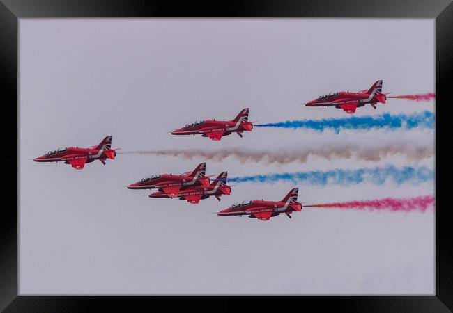 Red Arrows with coloured smoke on at Duxford Framed Print by Clive Wells