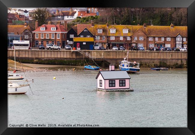 Floating house in Folkestone Harbour in Kent Framed Print by Clive Wells