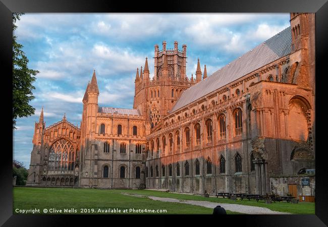 Turning red during the sunset, Ely Cathedral in al Framed Print by Clive Wells