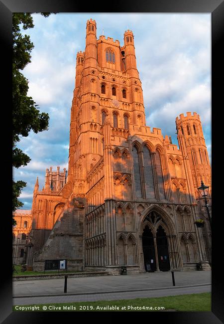 Tower turning red in the late sunset Framed Print by Clive Wells