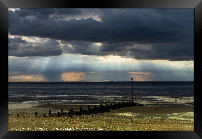 Dark skies over the Wash at Hunstanton Framed Print by Clive Wells