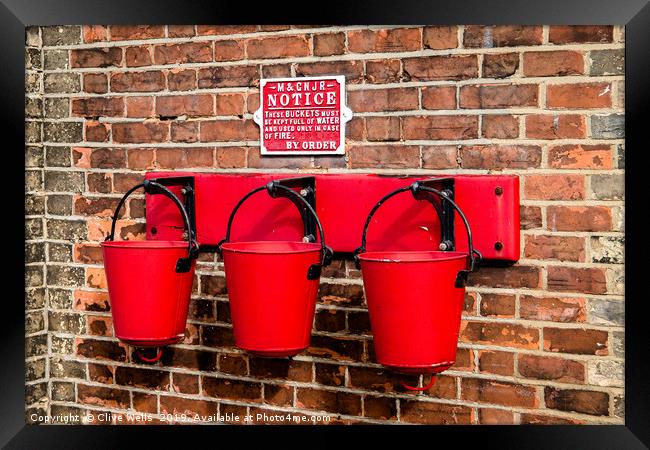 Fire buckets Framed Print by Clive Wells