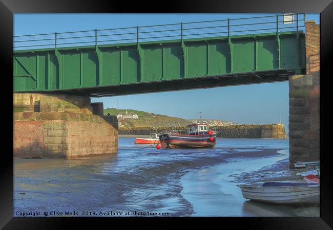 View under the railway bridge at Folkestone Harbou Framed Print by Clive Wells
