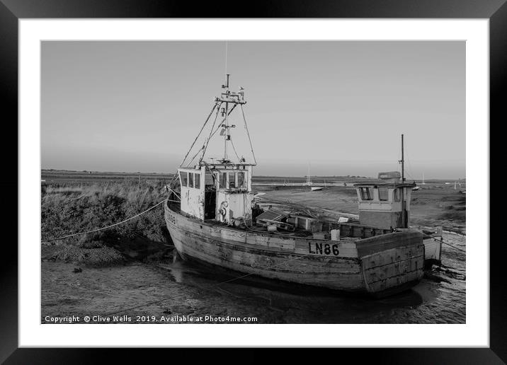 Monochrone fishing boat at Brancaster Staith Framed Mounted Print by Clive Wells