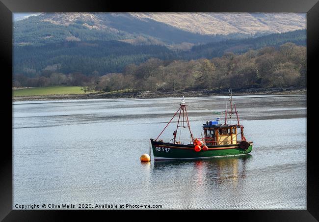 Fishing boat on Loch somewhere in Scotland Framed Print by Clive Wells