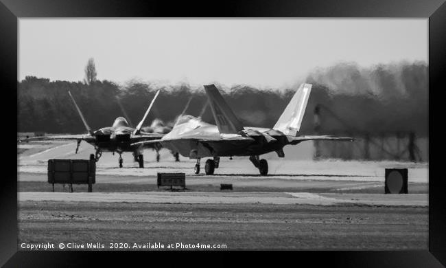 Lockheed Martin F-22A Raptors seen at Lakenheath Framed Print by Clive Wells