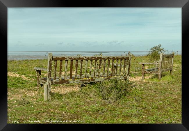 Wooden benches overlooking the Wash at Snettisham Framed Print by Clive Wells