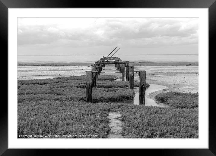 Black & white picture of the old pier at Snettisha Framed Mounted Print by Clive Wells