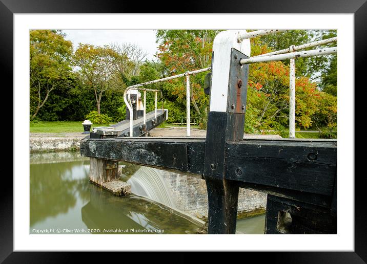 Overflowing lock gates. Framed Mounted Print by Clive Wells