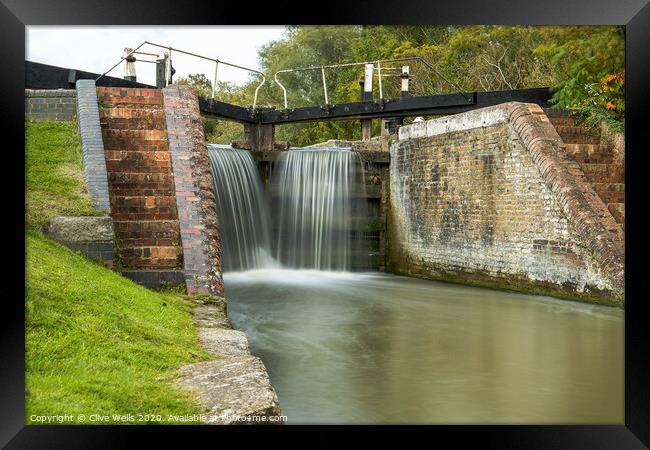 Close in of lock gates at Stoke Brurne. Framed Print by Clive Wells
