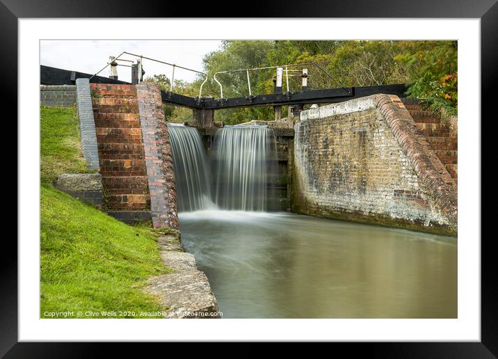 Close in of lock gates at Stoke Brurne. Framed Mounted Print by Clive Wells