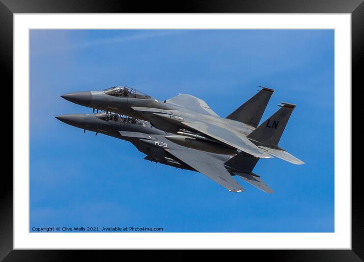 A pair of F-15 Eagles overfly Framed Mounted Print by Clive Wells
