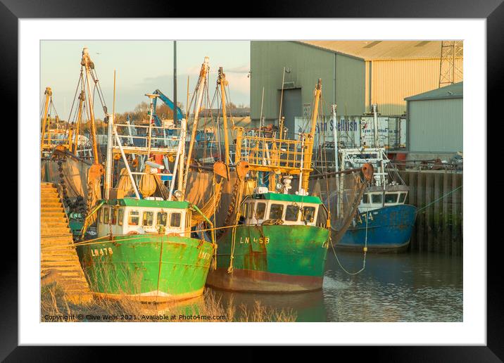 Fishing boats at low tide Framed Mounted Print by Clive Wells