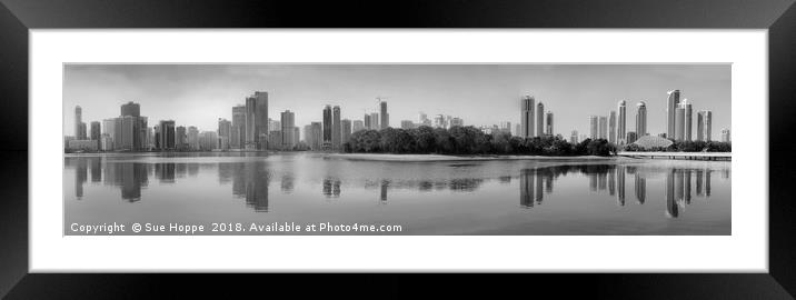 Sharjah Skyline reflected in water Framed Mounted Print by Sue Hoppe