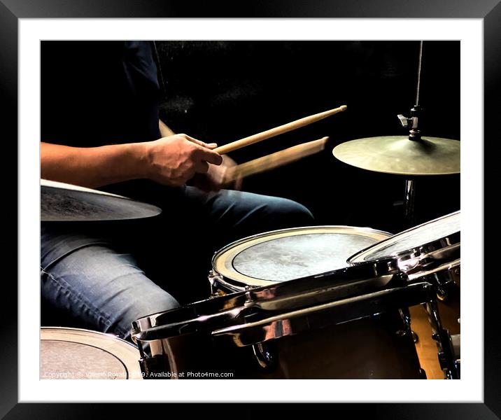 a drummer while playing the drums Framed Mounted Print by Valerio Rosati