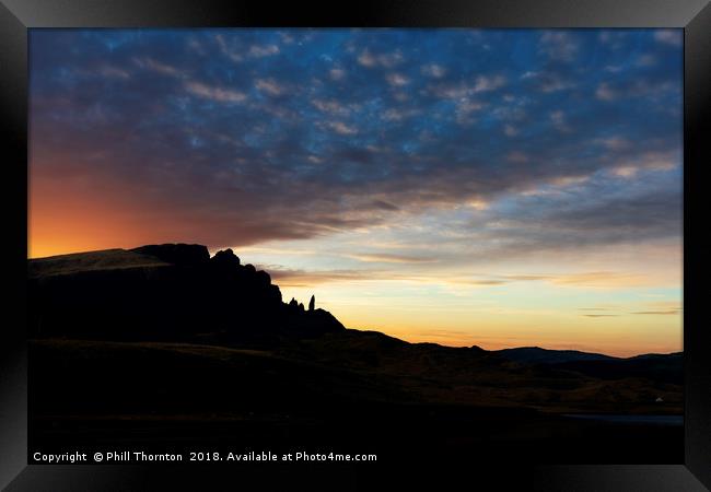 Sunsetting over The Old Man of Storr. Framed Print by Phill Thornton